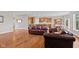 Spacious open-concept living area with hardwood floors connecting to the kitchen at 4434 Hickory Ridge Blvd, Greenwood, IN 46143