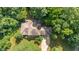 An aerial shot reveals the house's roof, driveway, and surrounding green landscape at 4446 Lakeridge Dr, Indianapolis, IN 46234