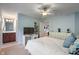 Bright bedroom featuring white furniture and a view into the en suite bathroom at 4446 Lakeridge Dr, Indianapolis, IN 46234