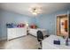 Comfortable bedroom featuring blue walls, white furniture, ceiling fan, and large window at 4446 Lakeridge Dr, Indianapolis, IN 46234