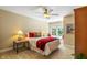 Cozy bedroom features a large window, bedside table, and overhead ceiling fan at 4446 Lakeridge Dr, Indianapolis, IN 46234