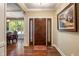 Elegant foyer boasts hardwood floors, a decorative front door and trim, and a view into the dining area at 4446 Lakeridge Dr, Indianapolis, IN 46234