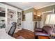 Another view of the well-lit home office showcasing built-in shelving and a comfortable workspace at 4446 Lakeridge Dr, Indianapolis, IN 46234