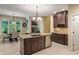 Elegant kitchen with granite counters, stainless steel appliances and an adjoining breakfast nook with fireplace views at 4446 Lakeridge Dr, Indianapolis, IN 46234