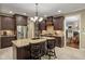 Well-equipped kitchen features granite countertops, stainless steel appliances, and a convenient island with seating at 4446 Lakeridge Dr, Indianapolis, IN 46234
