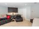 Relaxing living room with dark cabinets and a comfortable leather sofa set at 4446 Lakeridge Dr, Indianapolis, IN 46234