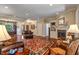 Spacious living room showcases a cozy fireplace, elegant built-ins, and a beautiful area rug at 4446 Lakeridge Dr, Indianapolis, IN 46234