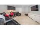 Spacious living room with dark cabinets, flat screen TV, and a comfortable leather sofa set at 4446 Lakeridge Dr, Indianapolis, IN 46234