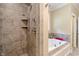 A large, tiled shower and separate soaking tub are highlights in this opulent, primary bathroom at 4446 Lakeridge Dr, Indianapolis, IN 46234