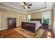 Cozy primary bedroom boasts an area rug, and well-lit, neutral paint throughout at 4446 Lakeridge Dr, Indianapolis, IN 46234