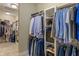 Spacious walk-in closet with custom shelving and ample storage space for shoes and clothing at 4446 Lakeridge Dr, Indianapolis, IN 46234