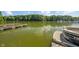 Scenic waterfront view with private boat dock, glistening water, and lush green trees at 4446 Lakeridge Dr, Indianapolis, IN 46234