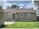 Backyard features a well-kept lawn, neutral exterior, and functional layout, perfect for outdoor enjoyment and relaxation at 4761 Payton Ave, Lawrence, IN 46226