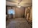 Spacious bedroom boasts a ceiling fan, large window, and stylish decor at 509 S E St, Arcadia, IN 46030