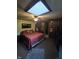 Comfortable main bedroom features a ceiling fan, a skylight, and plenty of space at 509 S E St, Arcadia, IN 46030