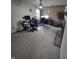 Office space with multiple desks, chairs, and computer setups, lit by overhead lighting and a nearby window at 509 S E St, Arcadia, IN 46030