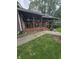 Inviting home porch featuring hanging plants and potted plants on a well-manicured lawn at 509 S E St, Arcadia, IN 46030