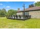 Wooden deck extending from the stone home, perfect for outdoor enjoyment at 5550 W Mooresville Rd Byp, Indianapolis, IN 46221