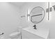 Modern bathroom features new vanity, toilet, mirror, and sleek dark hardware accents at 5550 W Mooresville Rd Byp, Indianapolis, IN 46221