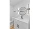 Modern bathroom features new vanity, toilet, mirror, and dark hardware accents at 5550 W Mooresville Rd Byp, Indianapolis, IN 46221