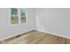 Bright bedroom with large window showing a view of the yard at 5550 W Mooresville Rd Byp, Indianapolis, IN 46221