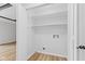 Organized closet with white shelving and rod for storage at 5550 W Mooresville Rd Byp, Indianapolis, IN 46221