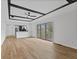 Bright open living room with view to kitchen and sliding glass door leading to the deck at 5550 W Mooresville Rd Byp, Indianapolis, IN 46221