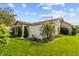 Charming back exterior with manicured lawn, privacy fence, and lush landscaping offering a serene outdoor space at 564 Parkhurst Ct, Greenwood, IN 46142