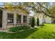 Well-maintained backyard with healthy green grass, lush landscaping, and a charming brick exterior at 564 Parkhurst Ct, Greenwood, IN 46142