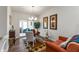 Bright dining area with wood floors, chandelier lighting, and access to the living area with a sliding glass door at 564 Parkhurst Ct, Greenwood, IN 46142