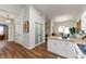 Open kitchen area showcasing ample storage, white cabinetry, and hardwood floors at 564 Parkhurst Ct, Greenwood, IN 46142