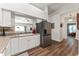 Bright kitchen with white cabinets, stainless steel appliances, and a functional layout at 564 Parkhurst Ct, Greenwood, IN 46142