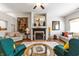 Comfortable living room featuring a fireplace, vaulted ceiling, and stylish furnishings at 564 Parkhurst Ct, Greenwood, IN 46142