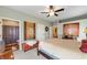 Spacious main bedroom with neutral paint, carpet, ceiling fan, and ensuite bathroom at 564 Parkhurst Ct, Greenwood, IN 46142