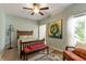 Neutral main bedroom with an accent wall, ceiling fan, and lots of natural light at 564 Parkhurst Ct, Greenwood, IN 46142