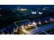 An aerial nighttime view highlights a stunning two-story home amidst a peaceful neighborhood at 5706 Bentbrook Dr, Bargersville, IN 46106
