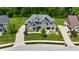 An aerial view of a two-story home with a meticulously manicured lawn and detailed landscaping at 5706 Bentbrook Dr, Bargersville, IN 46106
