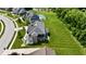 An aerial view of a two-story home showcasing a well-maintained lawn and covered patio with a spacious backyard at 5706 Bentbrook Dr, Bargersville, IN 46106