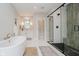 Beautiful primary bathroom featuring a glass enclosed shower, soaking tub, and designer fixtures at 5706 Bentbrook Dr, Bargersville, IN 46106