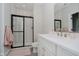 Modern bathroom with a glass-enclosed shower, white vanity, gold fixtures, and herringbone tile at 5706 Bentbrook Dr, Bargersville, IN 46106