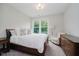 Comfortable bedroom features natural light and neutral decor; perfect for relaxation and rest at 5706 Bentbrook Dr, Bargersville, IN 46106