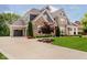 Stunning home featuring a stone and siding facade, attached garage and meticulously maintained landscaping at 5706 Bentbrook Dr, Bargersville, IN 46106