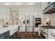 Modern kitchen with stainless steel appliances, custom cabinets, farmhouse sink and designer backsplash at 5706 Bentbrook Dr, Bargersville, IN 46106
