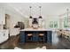 Open kitchen featuring a large island, white cabinets, stainless steel appliances and a breakfast nook at 5706 Bentbrook Dr, Bargersville, IN 46106
