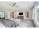 This spacious main bedroom offers a sitting area, tray ceiling, and access to a walk-in closet at 5706 Bentbrook Dr, Bargersville, IN 46106