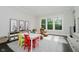 Bright playroom with table, colorful chairs, cozy seating and large windows for natural light at 5706 Bentbrook Dr, Bargersville, IN 46106