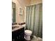 Cozy bathroom with a framed art and a shower with curtain at 5932 Edelle Dr, Indianapolis, IN 46237