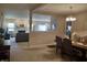 Open-concept dining room featuring a chandelier and views to the living room at 5932 Edelle Dr, Indianapolis, IN 46237