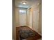 Inviting foyer with hardwood floors and a welcoming front door at 5932 Edelle Dr, Indianapolis, IN 46237