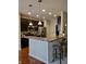 Modern kitchen with breakfast bar, stainless steel appliances, and recessed lighting at 5932 Edelle Dr, Indianapolis, IN 46237